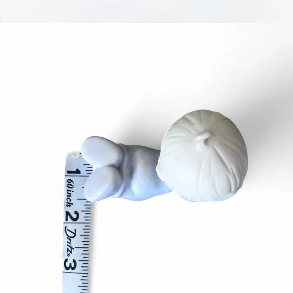 Adorable Precious Moments little girl lying down figurine in excellent condition